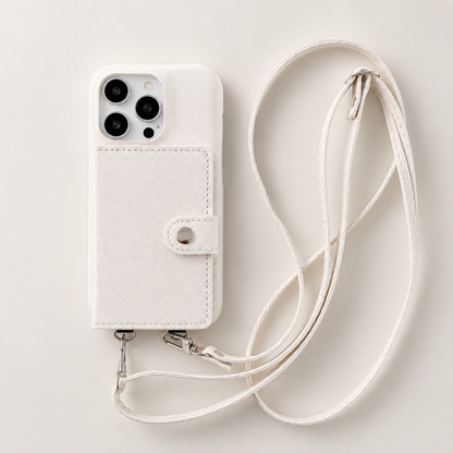 A cream woven-textured case lies on a pale surface beside its long matching strap. A stitched wallet panel with a small snap tab covers the back.