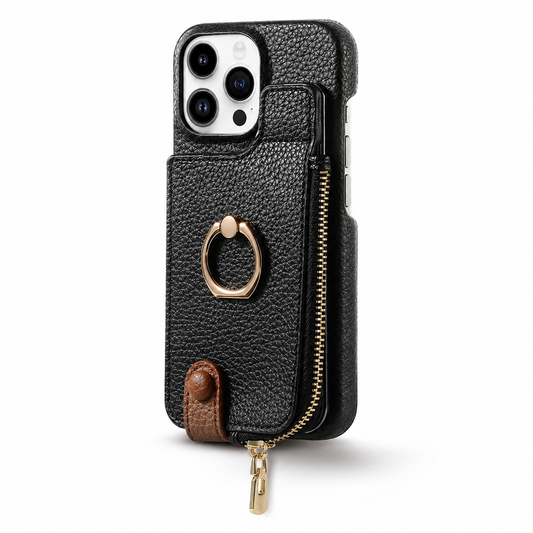 A black pebbled wallet phone case stands upright on white with its rear facing forward. A raised rectangular zippered compartment fills most of the back below the camera, with a gold folding finger ring at its center. A small brown snap tab closes near the bottom, and a gold zipper pull hangs beneath.
