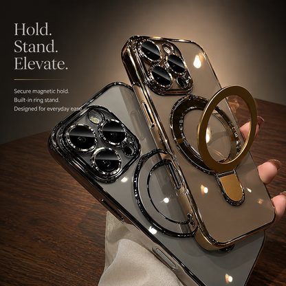 A hand holds silver and gold clear cases together, with the gold case's circular ring stand extended. Reflections shimmer across their lens borders.