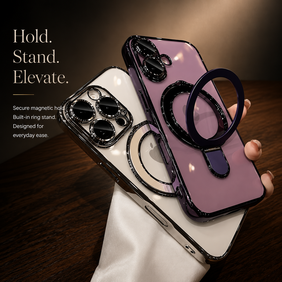 A hand holds silver and purple clear cases together above a wooden table. The purple ring stand is pulled outward.
