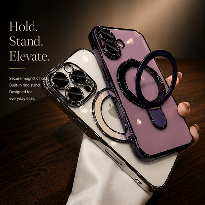A hand holds silver and purple clear cases together above a wooden table. The purple ring stand is pulled outward.