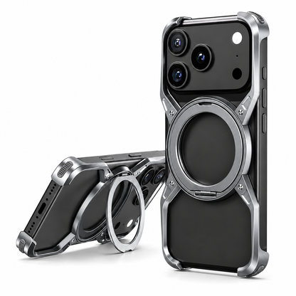 Two black phones wear silver-colored open-frame cases with circular rings and corner bumpers. One stands upright; the other rests horizontally with its ring extended as a stand.