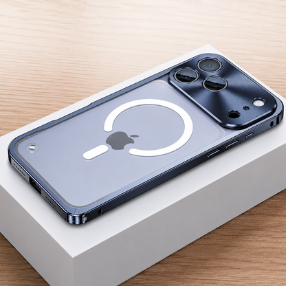 Blue framed case lies face down on a white box, showing a frosted transparent back with a white broken magnetic ring and alignment bar. A broad reflective camera panel surrounds three lenses.
