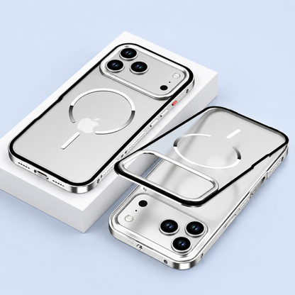A silver-colored phone case lies on a white block beside a separated translucent back panel and phone, showing white circular magnetic markings.