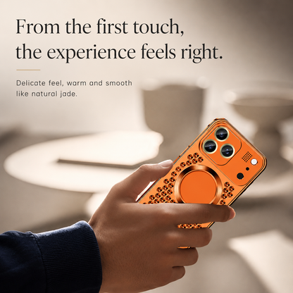 Hands hold an orange perforated case in a bright interior. Text describes a warm, smooth feel.