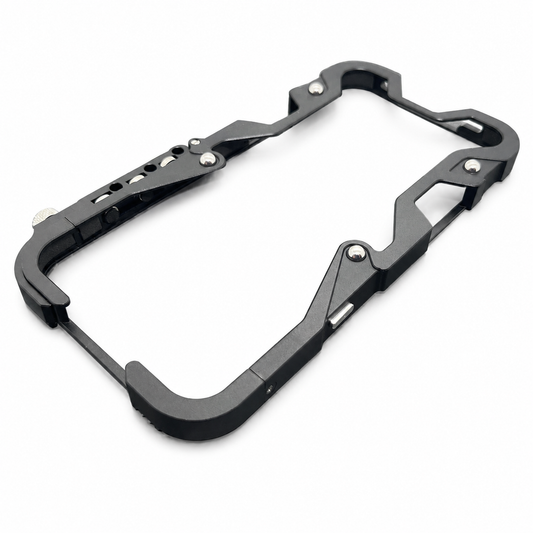 An empty black metal-looking bumper frame lies diagonally on white, with an open back, angular side guards and exposed silver screws.