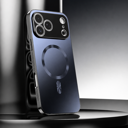 A slate-blue metallic-looking phone case leans upright on a glossy black pedestal. A shiny circular ring and short bar mark its back beneath a broad black camera panel.