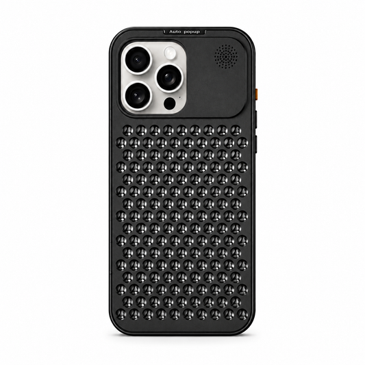 A black phone case stands upright against white. A dense grid of circular three-spoke openings covers the back below the camera area, with a small perforated circle in the upper right.