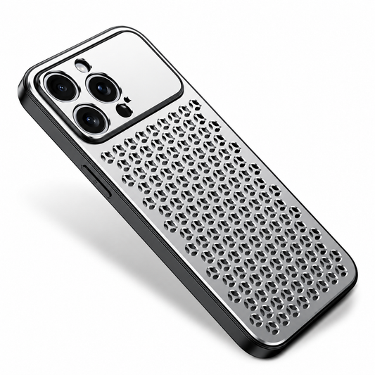 A silver case lies diagonally on white. Its back is perforated with repeated three-lobed openings beneath a shiny rectangular camera panel, with black edging around the perimeter.