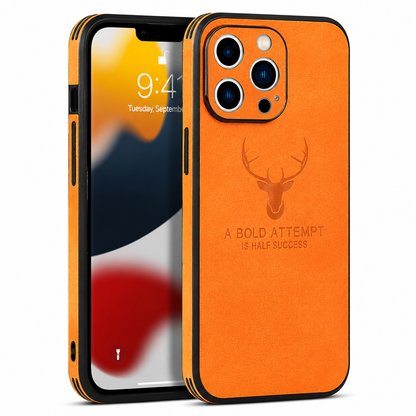 Front and back views show an orange fabric-textured phone case against white. A stag head appears above the words 'A bold attempt is half success,' beneath a three-lens camera opening.