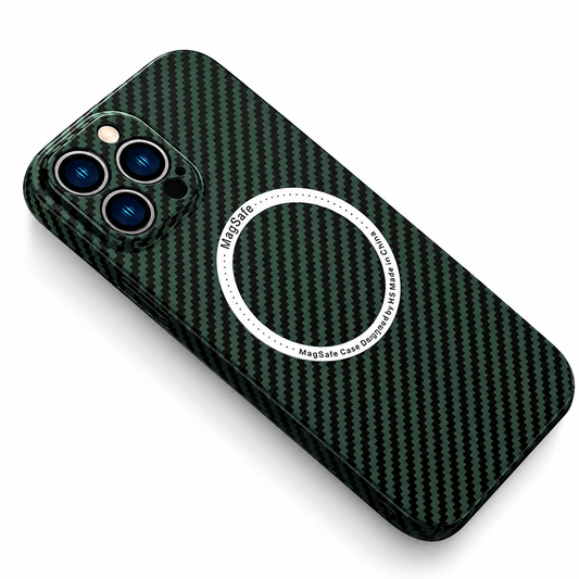 A phone case with a black and green diagonal woven pattern lies at an angle on white, rear facing upward. A white circular magnetic alignment marking sits at the center of the back, with small lettering around the ring. A rounded square camera surround encloses three lenses and a flash at the upper corner.