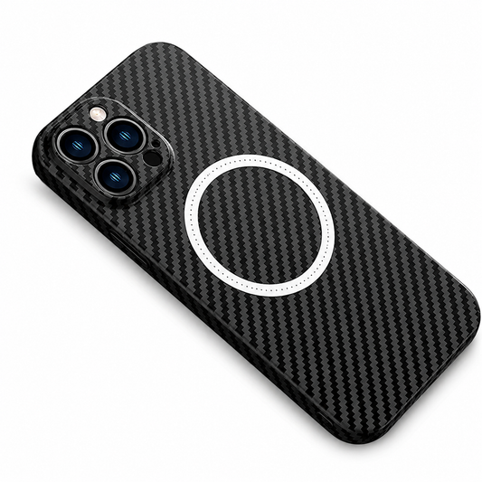 A phone case with a black and gray diagonal woven pattern lies at an angle on white, rear facing upward. A white circular magnetic alignment marking sits at the center of the back, with small lettering around the ring. A rounded square camera surround encloses three lenses and a flash at the upper corner.
