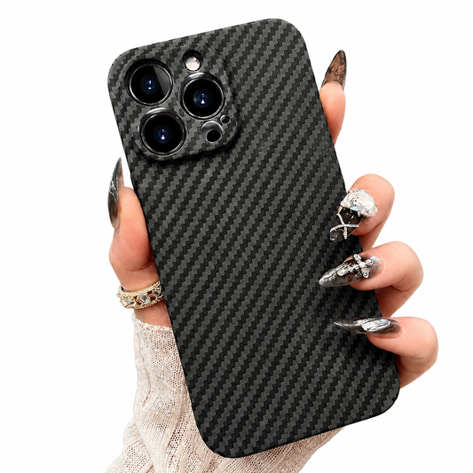 A hand with dark decorated nails holds a black diagonally woven-patterned case on white, showing its three-lens camera opening.