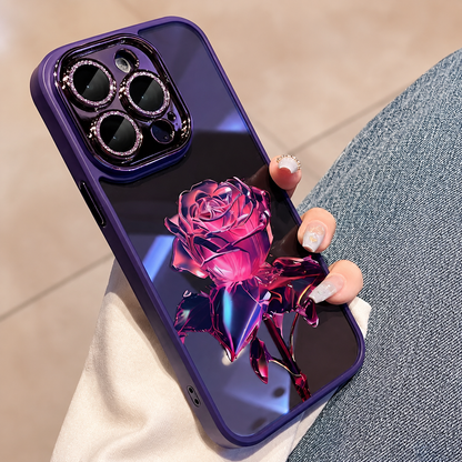 A hand holds a glossy purple case beside blue jeans, with a vivid magenta faceted rose and dark pink leaves on the back.
