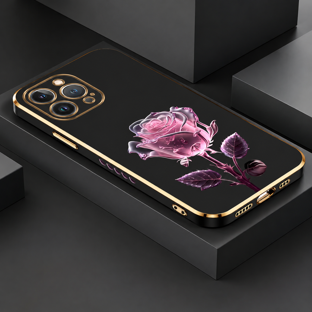 A black gold-edged case with a pink rose illustration lies rear-up on a dark display platform.