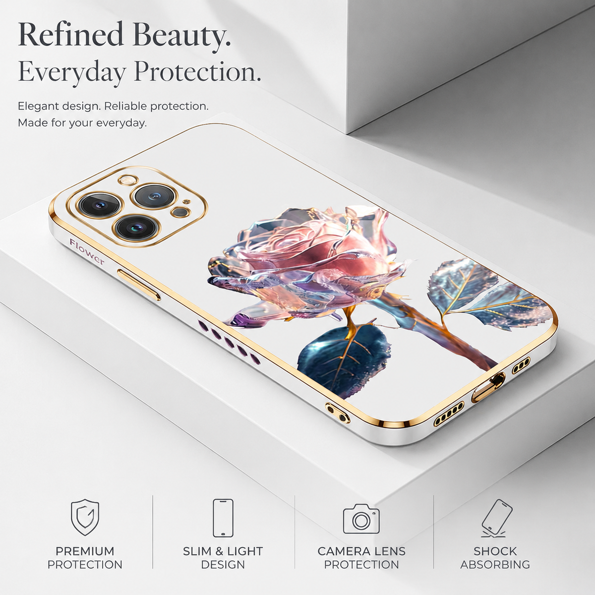 A white gold-edged case with a pale pink faceted rose lies on white blocks. Icons advertise protection, slim design and camera-lens protection.