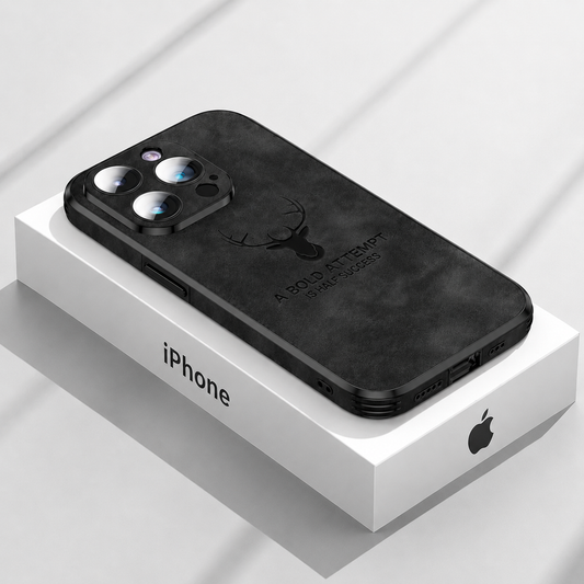Black suede-look deer-emblem case rests on an iPhone box against pale gray, with black straight-edge trim and a raised three-camera panel.