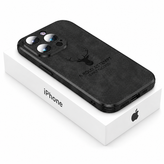 Black suede-look phone case lies on a white iPhone box against white. A deer-head emblem and A Bold Attempt Is Half Success lettering decorate its back.