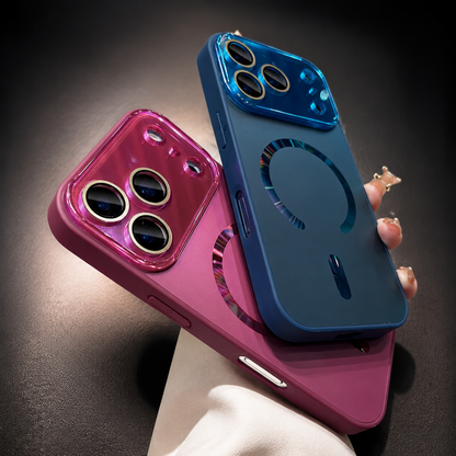 Blue and pink cases overlap in a hand, with reflective magnetic rings and matching glossy camera panels above their smooth backs.