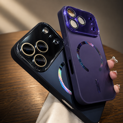 Hand holds black and purple cases together, showing reflective rainbow-tinted magnetic rings and glossy camera panels with gold-colored lens surrounds.