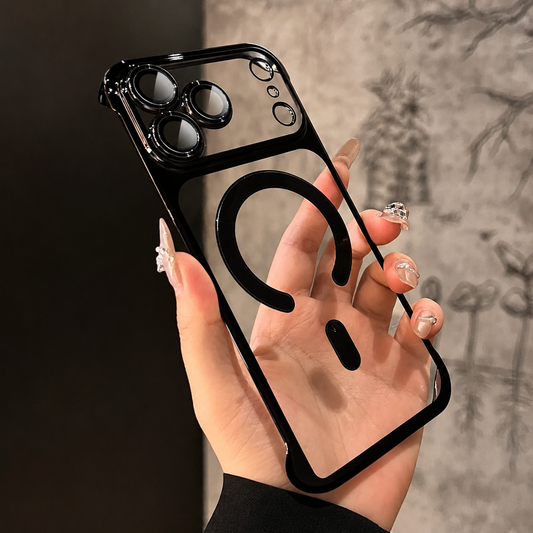 Hand holds an empty clear case with black trim, matching individual camera lens surrounds, and a broken circular magnetic ring with alignment bar. Fingers show through the transparent back.