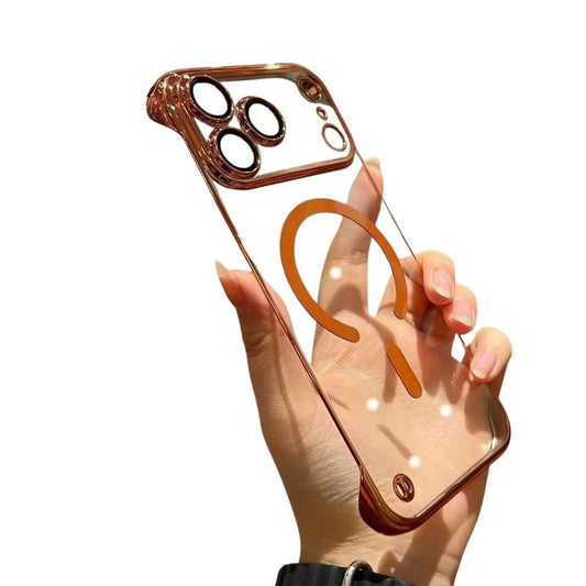 Hand holds an empty clear case with bronze-colored trim, matching individual camera lens surrounds, and a broken circular magnetic ring with alignment bar. Fingers show through the transparent back.
