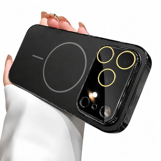 Hand holds a black case horizontally against white. A gray circular magnetic marking and short bar decorate the matte back beside a glossy camera panel with gold-colored lens rings.