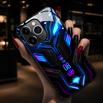 A hand holds a blue-and-purple circuit-patterned case close to the camera in a warmly lit interior.