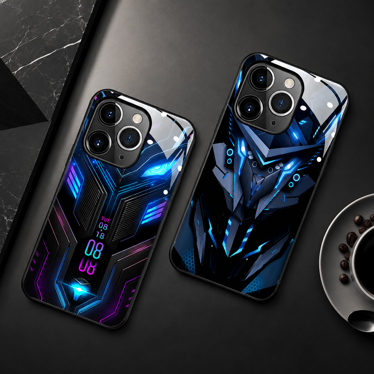 Blue circuit-patterned and blue robotic-face cases lie diagonally on a dark surface beside a black marble block.