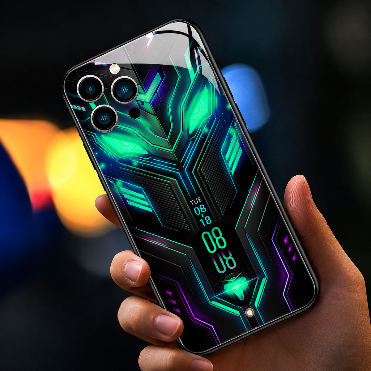 A hand holds a glossy black case with green-blue circuit-like lines, a geometric upper shape and glowing digital-style numerals.