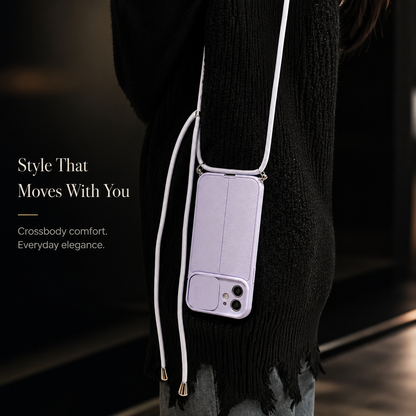 A person in dark clothing wears a lavender case upside down on a long matching crossbody cord, with the camera slider closed.