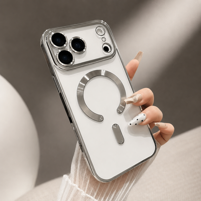 A hand holds a silver-trimmed clear case on a white phone, showing its individual camera rims and shiny horseshoe-shaped ring and bar.