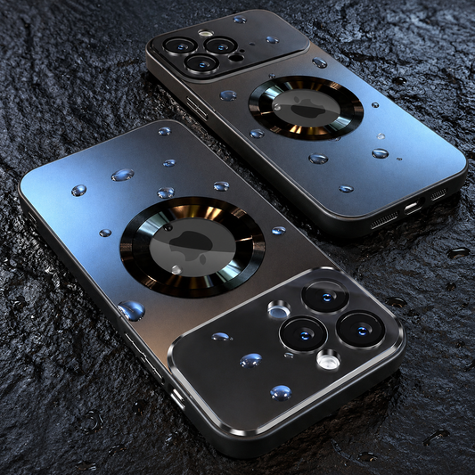 Two dark metallic-looking phone cases covered with water droplets lie on a rough dark surface, with glossy camera panels and circular back rings.