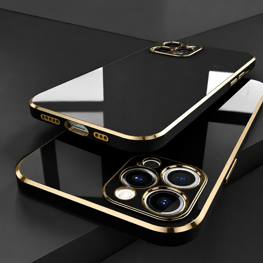 Two glossy black phone cases overlap on black blocks. Gold-colored borders outline their backs and three-lens camera surrounds, with bright window reflections across the smooth surfaces.