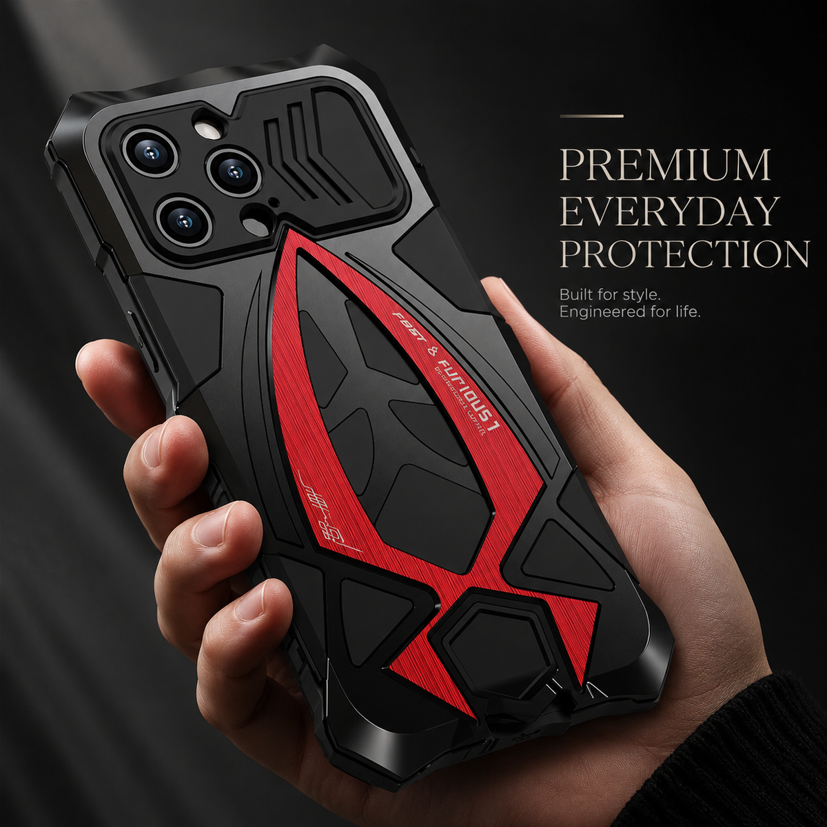 A hand holds a black case with a bold red shield-like rear accent and a sliding camera cover beneath Premium Everyday Protection.