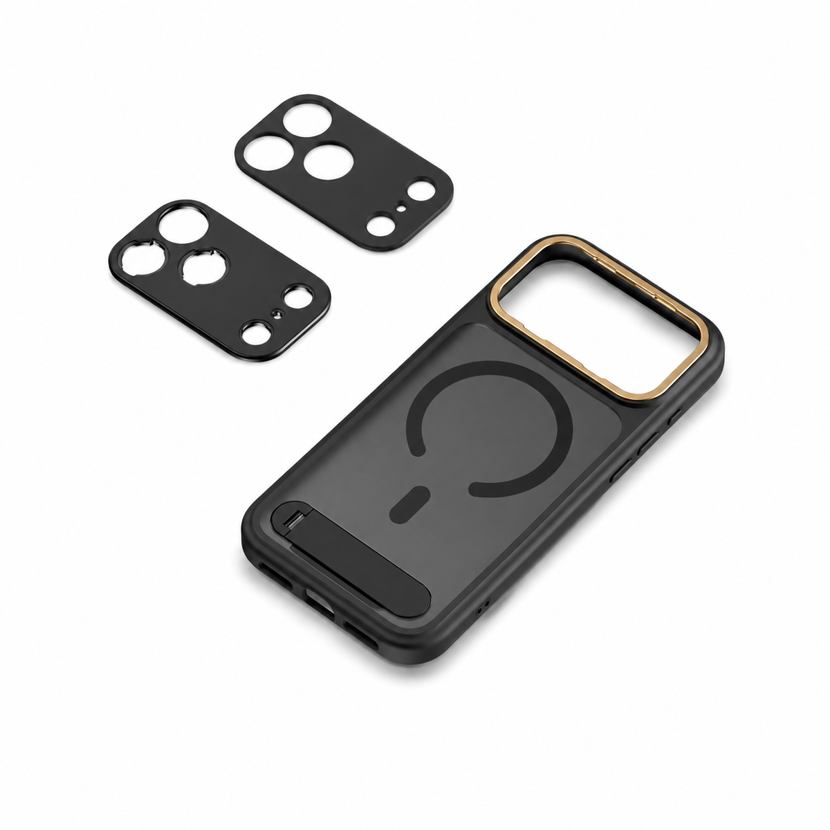 An empty black photography phone case lies diagonally on white beside two removable camera plates with circular lens openings. A circular magnetic marking and short alignment bar occupy the back, with a recessed folding stand near the bottom and a broad camera opening above.