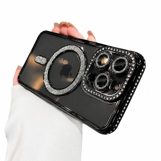 A hand in a white sleeve holds a black phone case horizontally against white. Silver glitter outlines the back ring and short bar, while rhinestone-like studs border the camera surround and edges.