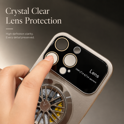 A finger touches a circular camera opening in the broad glossy panel of a gray case beneath Crystal Clear Lens Protection.