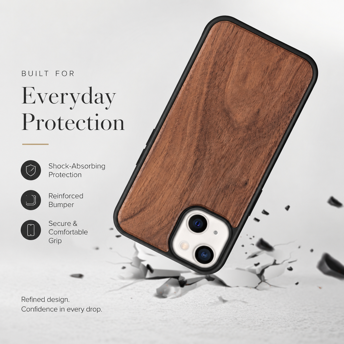 A wood-backed phone is illustrated tilted onto its lower corner among scattered gray fragments on a pale surface. Its warm brown panel, black border, and pale three-lens camera opening face the viewer. Text at left reads 'Everyday Protection,' with icons describing shock absorption, a reinforced bumper, and a comfortable grip.
