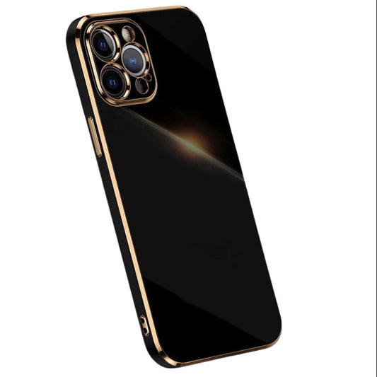 Glossy black phone case tilted upright against white, with gold-colored trim around its straight edges and individual camera openings.