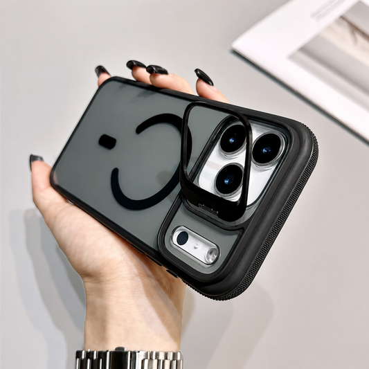 A hand holds a smoky clear case horizontally with a black rear ring and rectangular camera-frame stand raised above the three lenses.
