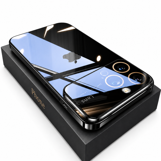 A glossy black-edged phone case lies face down on a black box against white. Window reflections cross its clear back and black camera panel, with gold-colored rings around two visible lenses.