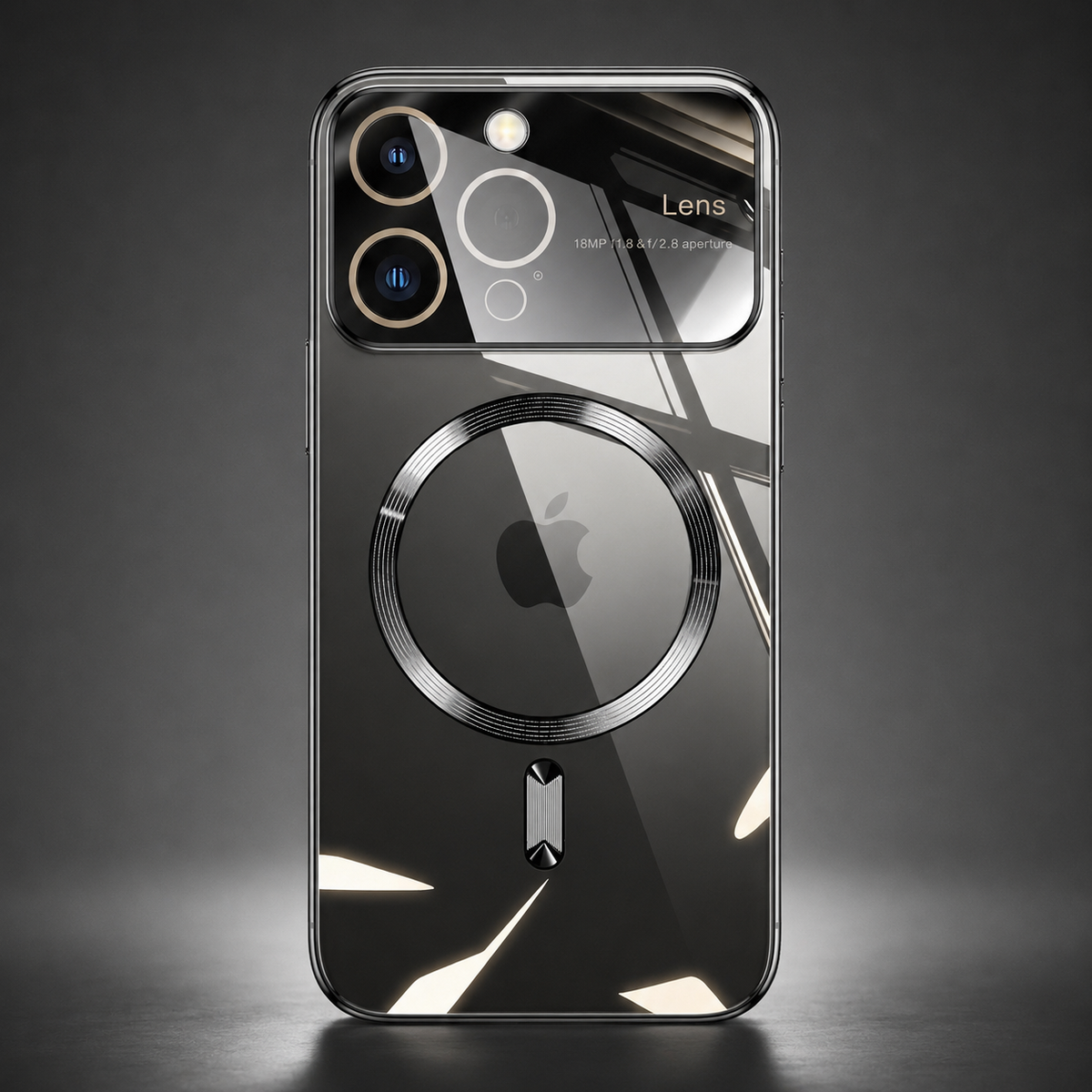 A dark reflective phone case stands upright alone against a gray spotlighted background. A large circular magnetic marking surrounds the Apple logo below the camera panel, with a short bar beneath. Angular white reflections cross its glossy back, and a dark reflection extends onto the surface below.