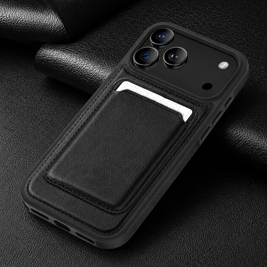 A black stitched phone case lies diagonally on black textured fabric. Its matching rectangular card pouch holds a white card below the broad camera panel.