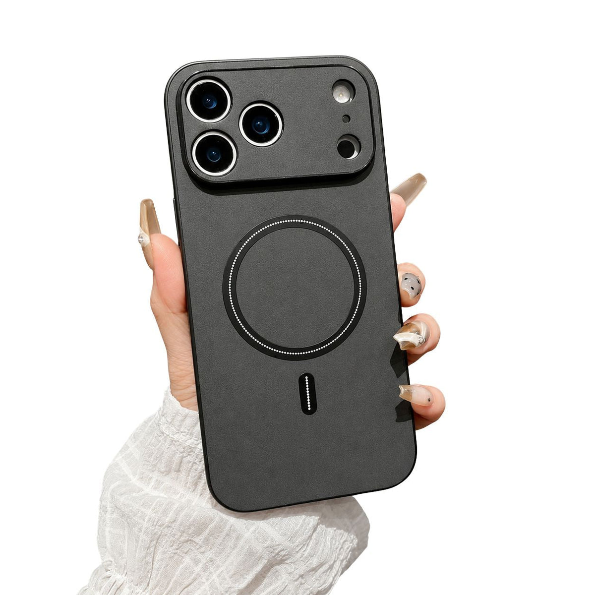 A manicured hand holds a dark gray leather-look phone case with black edges, a matching wide camera guard and a black circular ring and bar on its back.