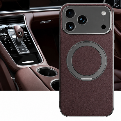 A dark brown textured case stands in front of a brown car interior, showing its flat circular folding ring and silver-colored camera border.