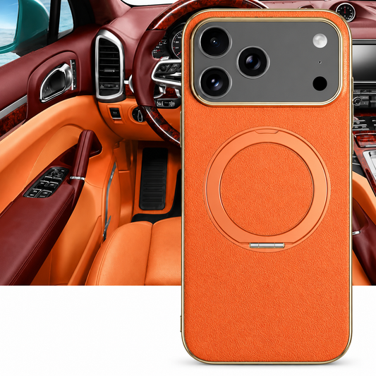 An orange textured phone case stands in front of a matching orange car interior. A flat circular folding ring sits on its back beneath the broad camera panel.