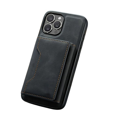 Angled rear view of a black leather-look phone case with a stitched rectangular wallet attached below its square camera opening. Tan stitching outlines the wallet's notched flap.