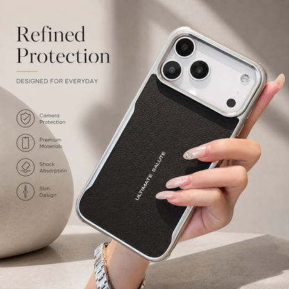 A hand holds a black textured phone case with reflective edging. Feature icons advertise camera protection, shock absorption and a slim design.