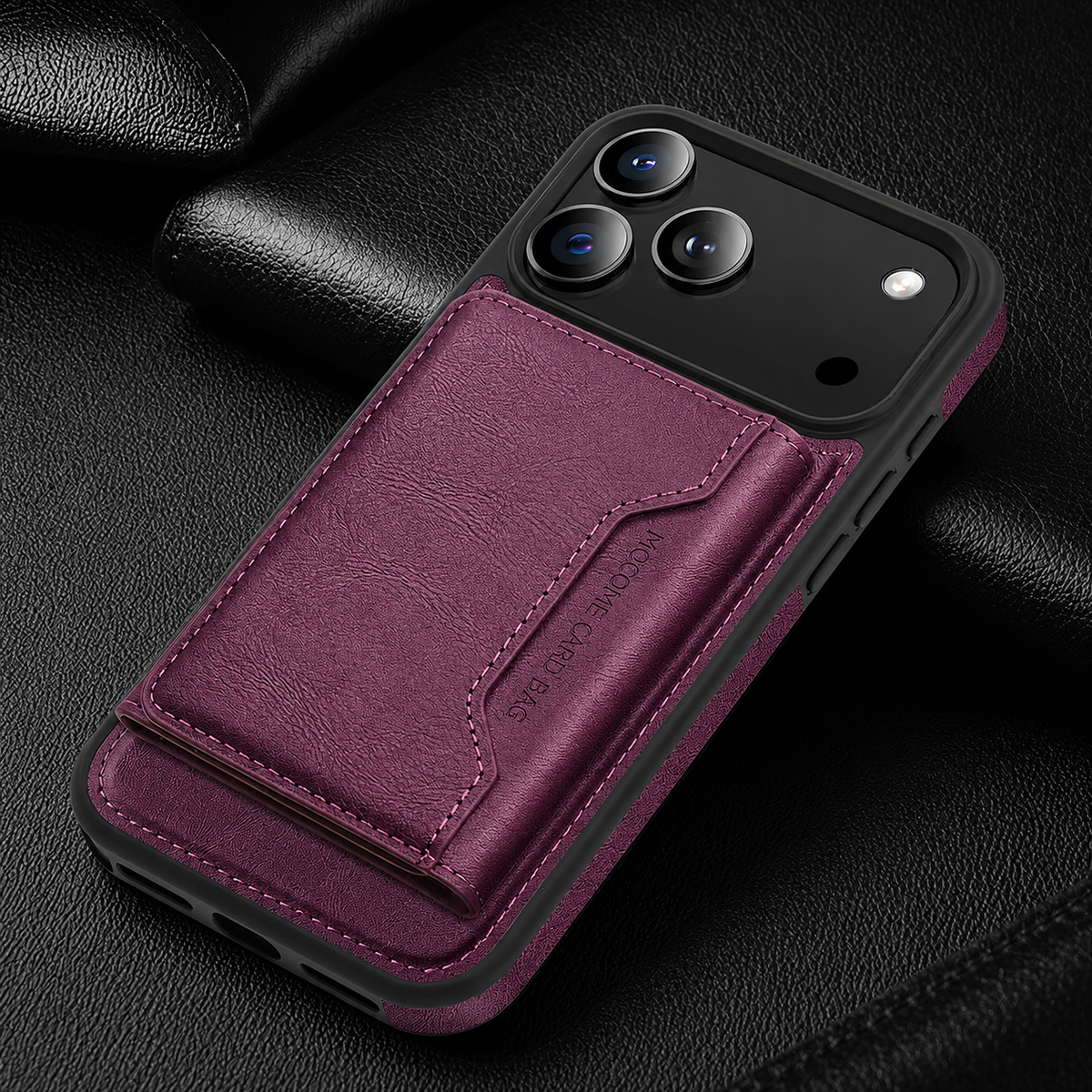 A burgundy wallet case lies diagonally on black fabric, with a matching rear flap below the camera panel.